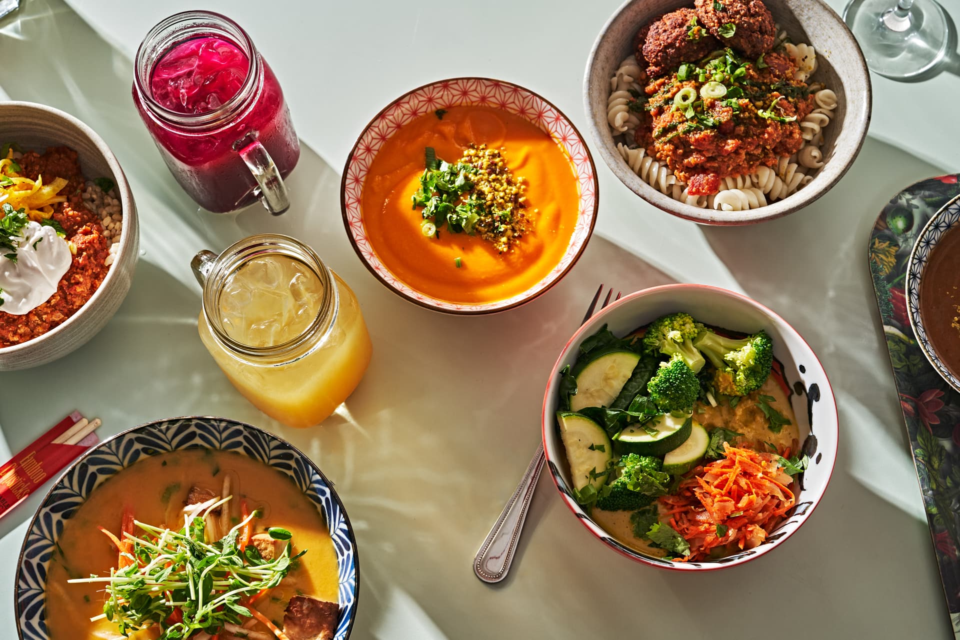 Le Botaniste colorful spread of bowls and drinks